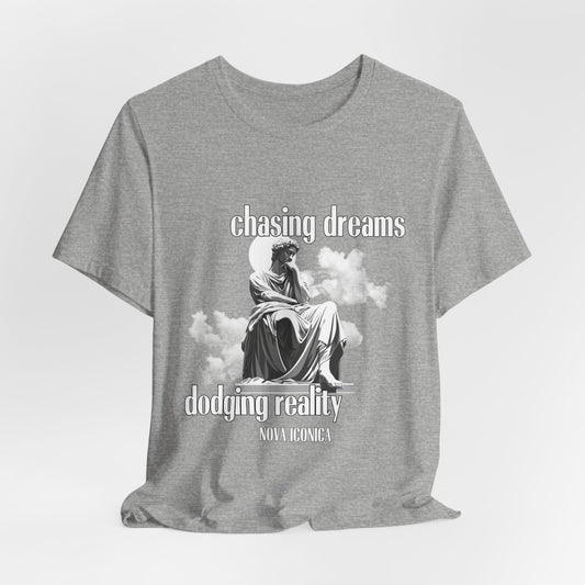 Unisex Chasing Dreams Dodging Reality Tee in heather grey, inspirational shirt for dreamers and adventurers.